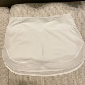 Lululemon size 4 white tennis skirt with mesh trim.